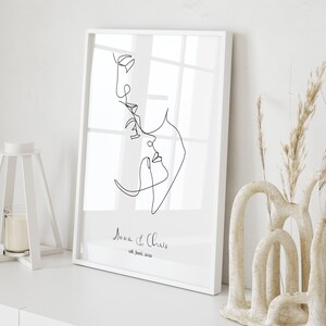 May include: A black and white line drawing of a couple's faces, with the text "Anna & Chris 08. Juni. 2021" below the drawing.