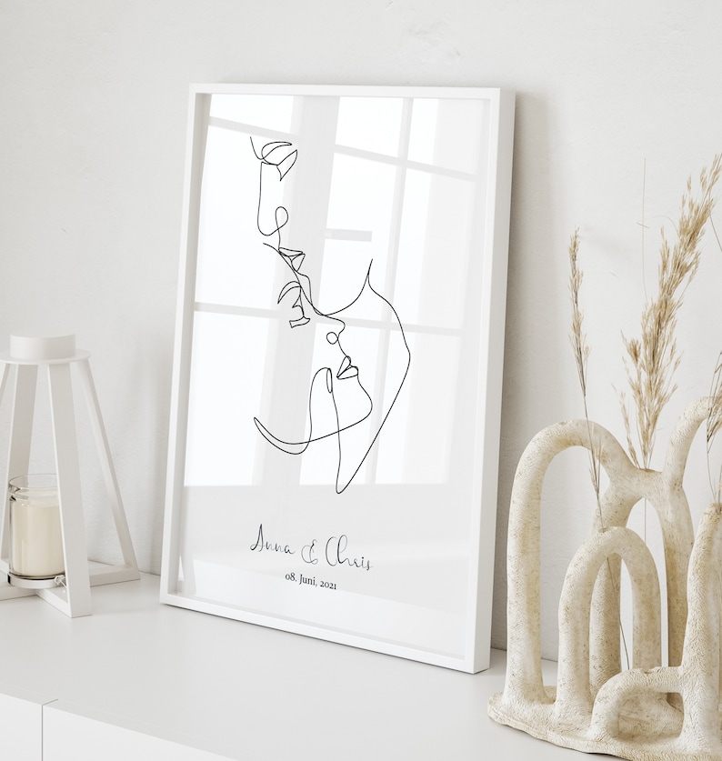 May include: A black and white line drawing of a couple's faces, with the text "Anna & Chris 08. Juni. 2021" below the drawing.