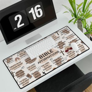 May include: A beige and brown mousepad with a Bible affirmations design. The mousepad features a variety of Bible verses and quotes, including "Rejoice in the Lord always", "Love your neighbor as yourself", "The Lord is my shepherd", and "Trust in the Lord always".