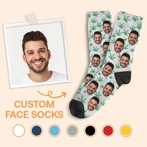 May include: Custom face socks with a white background and a green marijuana leaf pattern. The socks feature a repeated image of a person's face.