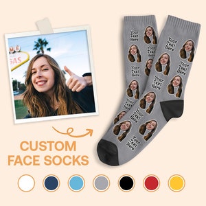 May include: Gray custom face socks with a repeated pattern of a woman's face. The text "Your Text Here" is printed on each sock. The socks are shown against a light orange background.