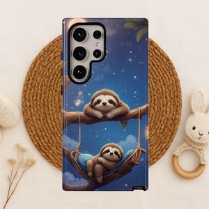 May include: A phone case featuring a whimsical illustration of two sloths. One sloth rests on a branch, while the other relaxes in a hammock. The background depicts a starry night sky with a full moon, creating a serene and charming design.