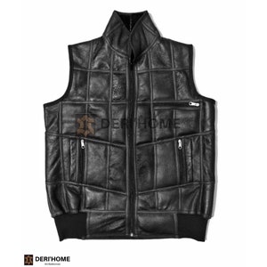 May include: A black leather vest with a zip fastening and multiple pockets. The vest is made of quilted panels and has a ribbed knit bottom.