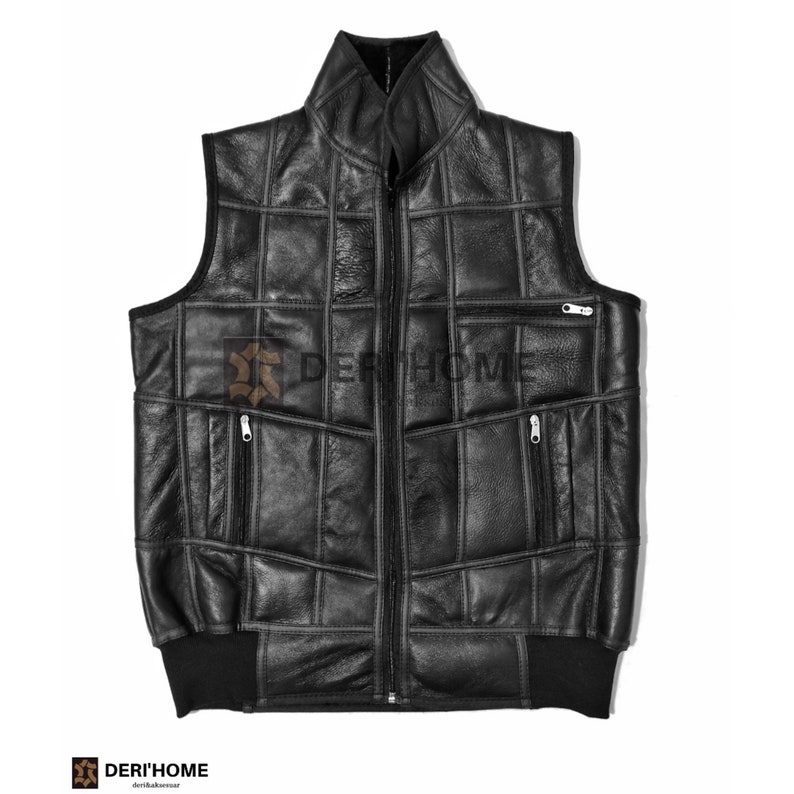 May include: A black leather vest with a zip fastening and multiple pockets. The vest is made of quilted panels and has a ribbed knit bottom.
