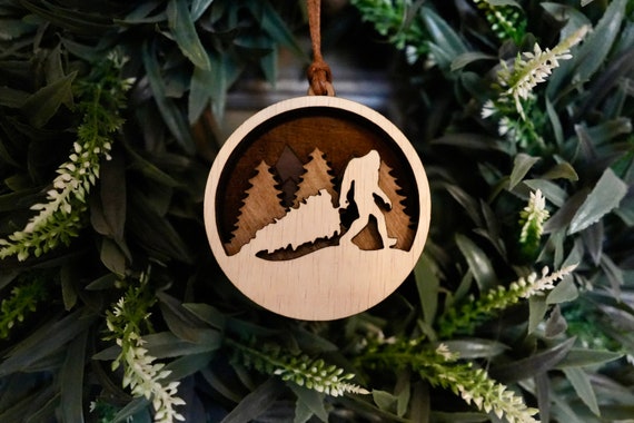 Sasquatch walking his dog - Cedar Ornament Sasquatch walking his dog - Cedar Ornament