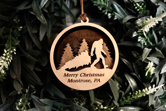 Sasquatch walking his dog - Cedar Ornament Sasquatch walking his dog - Cedar Ornament