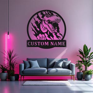 May include: Black metal wall art featuring a dinosaur head breaking through a wall with the text "CUSTOM NAME" below.