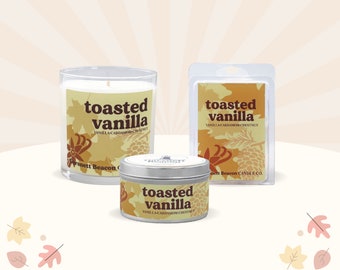 May include: Three candles in different sizes with a toasted vanilla scent. The candles are in glass jars and a tin container. The labels are yellow and brown with the text "toasted vanilla" and "vanilla-cardamom chestnut".