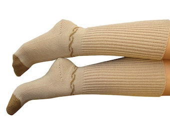 May include: Tan-colored socks with a ribbed design and a decorative wavy pattern near the top. The toe and heel are a darker shade of tan. The socks extend up the leg, covering the ankle and lower calf.