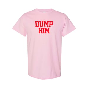 May include: Pink t-shirt with the text "DUMP HIM" in red.