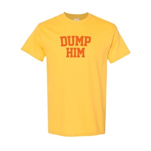 May include: Yellow short-sleeved t-shirt with the text "DUMP HIM" in red.