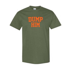 May include: A green t-shirt with the text "DUMP HIM" in orange letters.