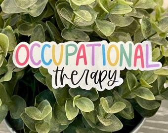 May include: A sticker with the words "Occupational Therapy" in rainbow colors on a green plant in a silver pot.