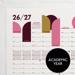 May include: Academic year calendar with a minimalist design. The calendar features a colour-blocked layout with pink, gold, and burgundy accents. Months are labelled, and the dates are clearly displayed. The calendar is for the 26/27 academic year.