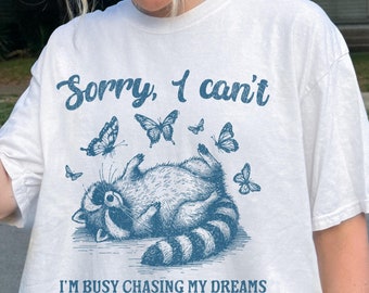 Funny Shirt, Busy Chasing My Dreams Raccoon T-Shirt, 90s Y2K Retro Vintage Graphic Tee, Trendy Shirt, Unisex Tshirt, Gift For Him or Her
