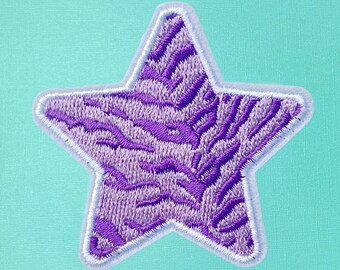 May include: Purple star-shaped patch with a white outline and a zebra-like pattern.