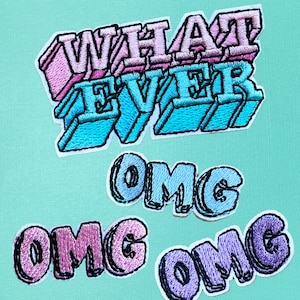May include: Three embroidered iron-on patches with the words "What Ever", "OMG", and "OMG" in pink, blue, and purple.