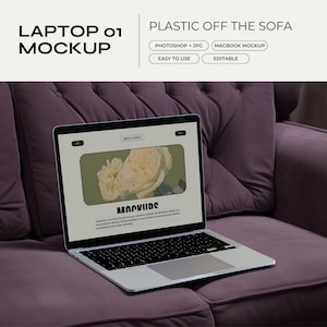 May include: A silver laptop computer with a white screen displaying a website with the text "MOCKUDS" and a picture of a white rose. The laptop is sitting on a purple sofa.
