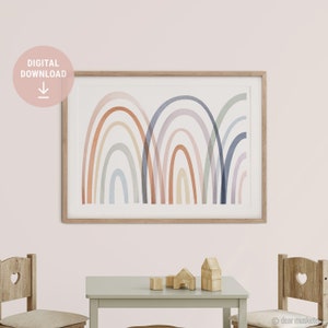 May include: A framed art print featuring a watercolor rainbow design in soft pastel colors. The artwork includes arches in shades of orange, yellow, blue, and purple. The words "DIGITAL DOWNLOAD" are in a pink circle in the upper left corner.