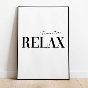 May include: A black framed poster with white background and the text "Time to RELAX" in black.