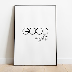 Könnte beinhalten: Ein schwarzer gerahmter Druck mit dem Text "GOOD night" in Weiß.