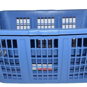 May include: A light blue plastic laundry basket with a rectangular shape. The basket has a grid-like pattern on the sides and a solid rim. The design includes rectangular openings for ventilation. The basket is designed for carrying and storing clothes.