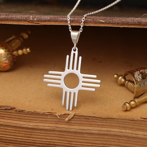 Sterling Silver Zia Sun Pendant - New Mexico Symbol Jewelry