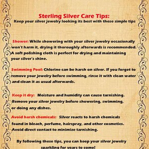 May include: A vintage-style poster with a decorative border provides sterling silver care tips. The text advises on maintaining silver jewelry, including drying after showering, avoiding chlorine, and harsh chemicals. The Artemis Design Jewelry logo is at the bottom.