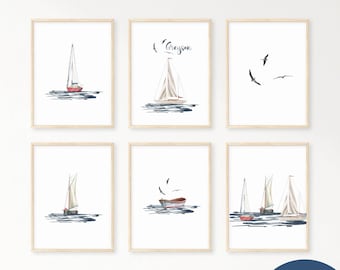 May include: Set of six watercolor prints featuring sailboats and seagulls. The prints are framed in natural wood frames and are arranged in a grid pattern on a white wall. The prints are perfect for a nautical themed nursery or bedroom.
