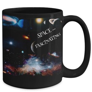 May include: Black ceramic mug featuring a vibrant space scene with planets, stars, and galaxies. The mug has the text "SPACE...FASCINATING" in white. The handle is black.