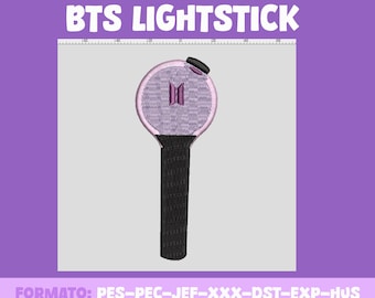 May include: An embroidery design of a purple and black BTS lightstick. The lightstick is a round sphere with a black handle. The sphere has a stylized "BTS" logo in the center.