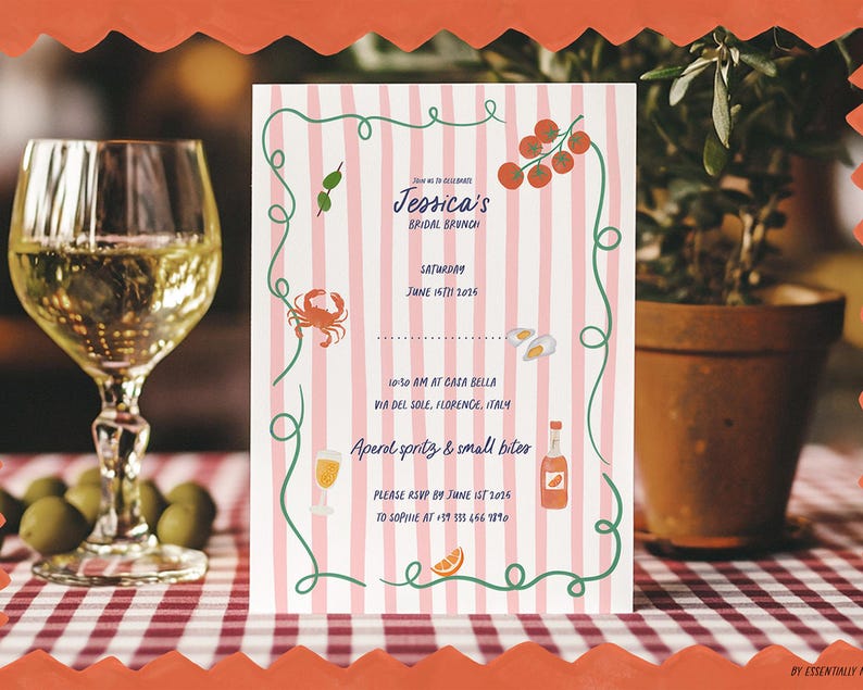 May include: A bridal brunch invitation with a pink and white striped background. The invitation features illustrations of food and drinks, including a crab, olives, and a glass of wine. The text reads "Jessica's Bridal Brunch". A glass of wine and olives are in the foreground.