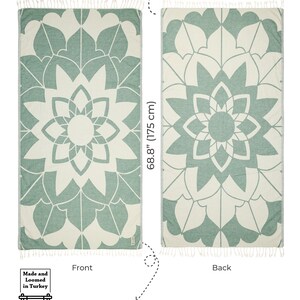 May include: A rectangular towel featuring a sage green and cream mandala pattern with tasseled ends. The towel measures 35.4 inches by 68.8 inches and weighs 13.58 ounces. The design is labeled as a special design, made and loomed in Turkey.