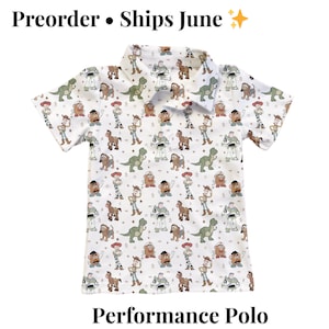 May include: White performance polo shirt featuring a pattern of cartoon characters. The shirt has a collared neckline and short sleeves. The text "Preorder &bull; Ships June" is at the top, and "Performance Polo" is at the bottom.