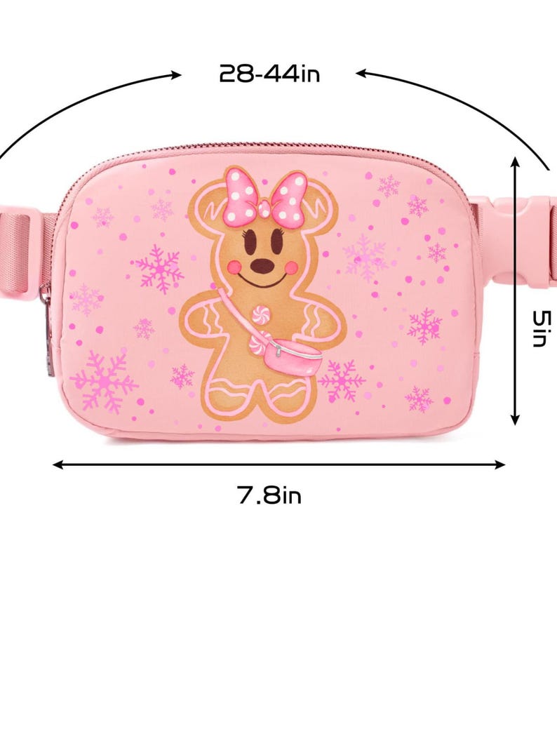 May include: Pink fanny pack with a gingerbread man design. The bag is 7.8 inches wide and 5 inches tall, with an adjustable strap that fits waists from 28 to 44 inches. The gingerbread man has a pink bow and a small pink purse.