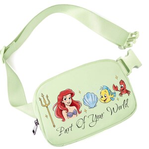 May include: White ceramic mug with a black handle, featuring the text "But First, Coffee" in black. The mug is displayed against a blurred backdrop, implying a comfortable environment.