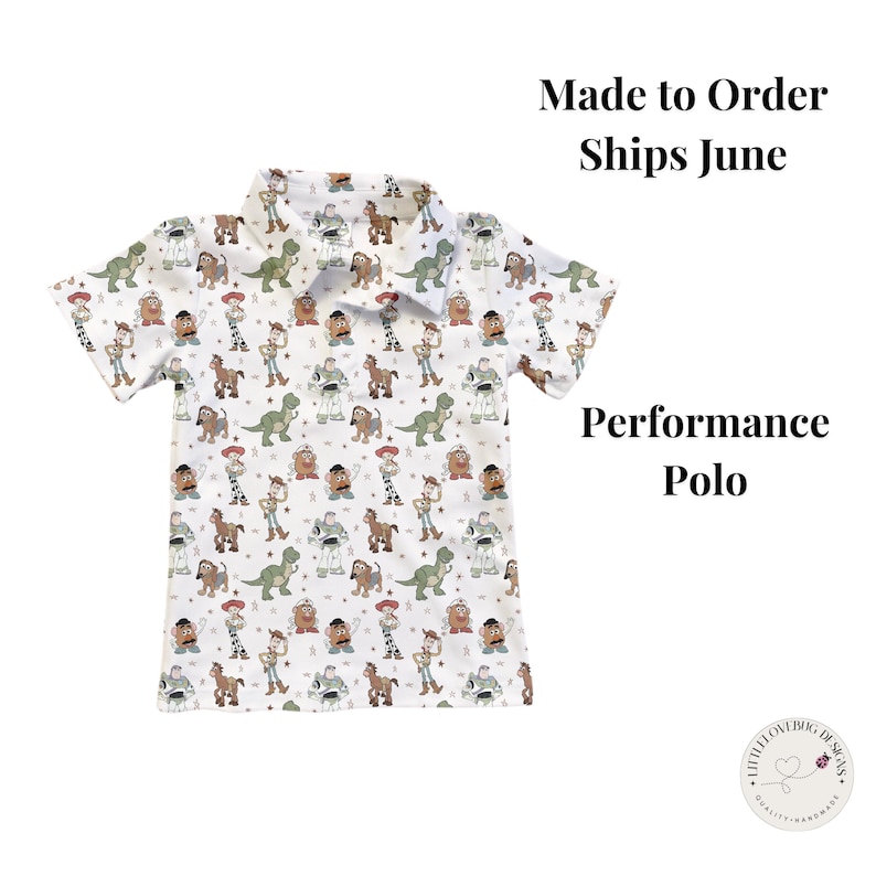 May include: White performance polo shirt with a pattern of cartoon characters. The shirt has a collared neckline and short sleeves. The text "Made to Order Ships June" and "Performance Polo" are visible.