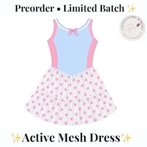 May include: A sleeveless dress featuring a light blue bodice with pink side panels, a white neckline trim, and a small pink bow at the center. The skirt is white with a pink polka dot pattern. Text reads: Preorder • Limited Batch Active Mesh Dress.