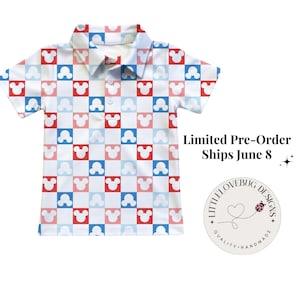 May include: A short-sleeve polo shirt featuring a repeating checkerboard pattern of red, light blue, and white squares, each containing a white mouse head silhouette. The shirt has a collar and a three-button placket down the center front.