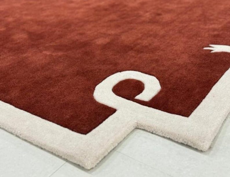 Alfombra moderna con mechones hechos a mano en color granate. Terra, hecha 100 % de lana de Nueva Zelanda. Ideal para sala de estar, dormitorio y salón. imagen 7