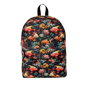 May include: A black backpack featuring a colourful pattern of fish and flowers. The fish are orange, red and yellow, and the flowers are pink, yellow and blue.