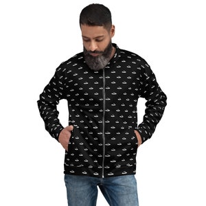 May include: A black bomber jacket with a white repeating pattern of small, stylised aeroplanes. The jacket has a zip closure and two pockets.