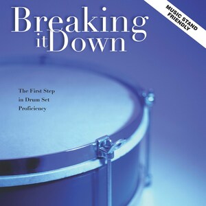 May include: A blue drum with a silver rim and a metal tension rod. The text "Breaking it Down" is at the top of the image. The text "The First Step in Drum Set Proficiency" is below the drum. The text "Music Stand Friendly" is in a black box in the upper right corner. The text "drumsRfun.com" is below the drum. The text "By Kevin White" is at the bottom of the image.
