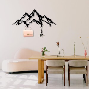 Key holder and coat rack combo in stylish mountain design