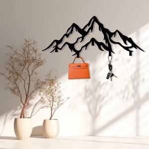 Black mountain-shaped hook rack for entryway organization