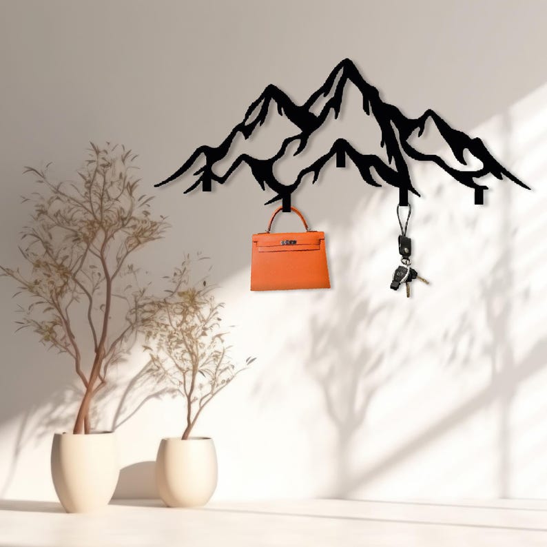 Black mountain-shaped hook rack for entryway organization