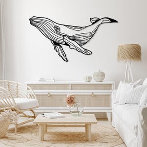 Whale metal wall art featuring large blue whale design