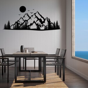 Contemporary metal wall decor showing forest and mountain view