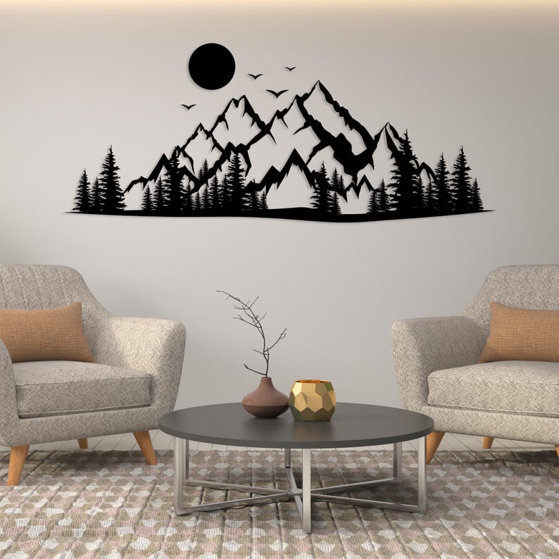 Metal wall decor featuring mountains trees and moon scene