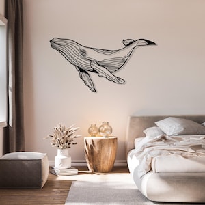 Modern ocean-themed wall decor with blue whale sculpture